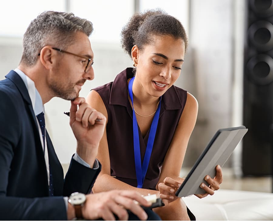 colleagues collaborating on a tablet device