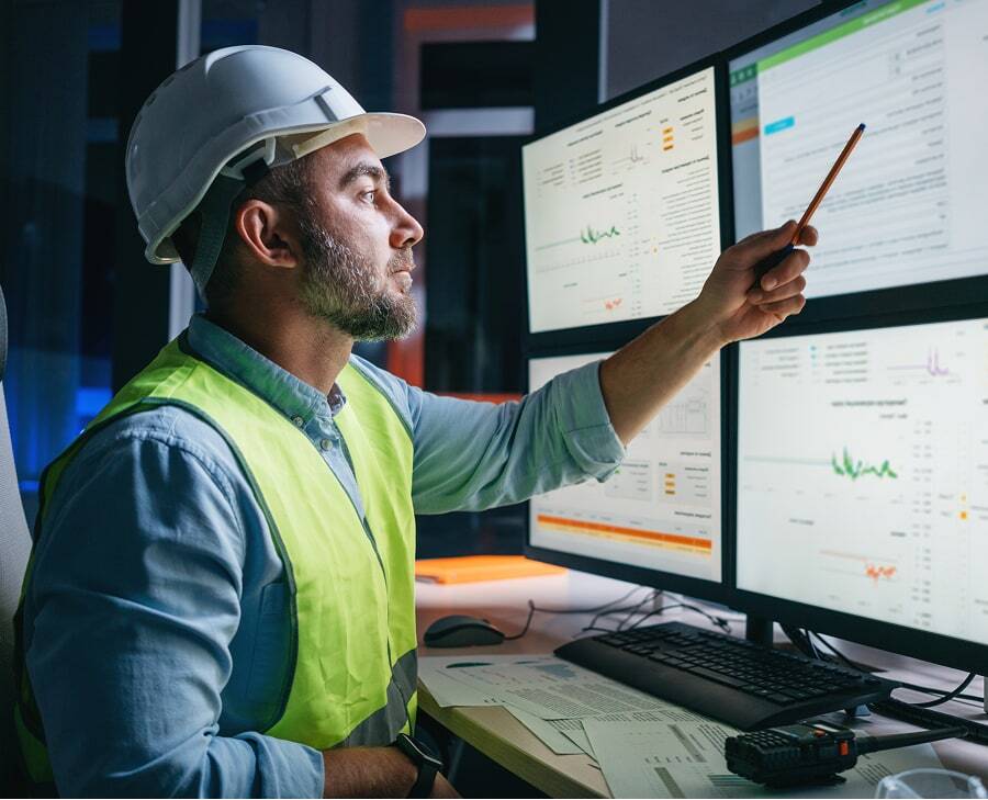 utility professional viewing computer monitors